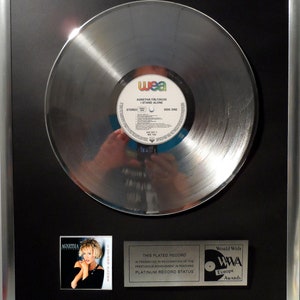 Collage with Agnetha Fältskog - I Stand Alone + silver / gold record