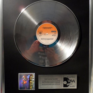 Collage with Bob Marley - The Birth of a Legend + silver / gold record