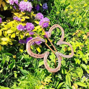 Butterflies made of horseshoe steel and rust for flowerbeds - iron art casting & design.
