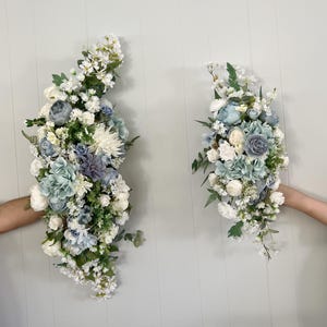 Wedding Arch Arrangements With Baby Blue, Dusty Blue and White faux flowers, dusty blue and white floral arbor arrangements, wedding arch