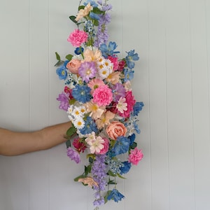 Colorful Arch Arrangements With Faux Flowers, Summer Wedding Table Arrangements, wild flowers arrangements, meadow arch decor, wedding swag