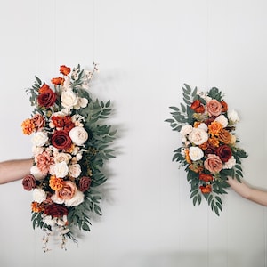Wedding Arch Arrangements With Rust Orange and Terracotta faux flowers, burnt orange floral arbor arrangements, altar decor, fall wedding