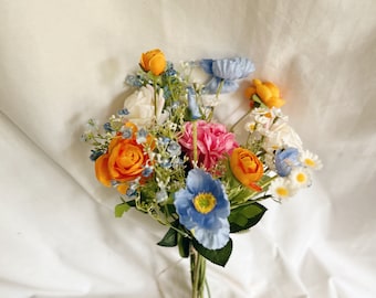 Bunch of faux flowers in blue, orange and hot pink colors for table decorating, wedding table centerpieces, wild flowers centerpiece, faux