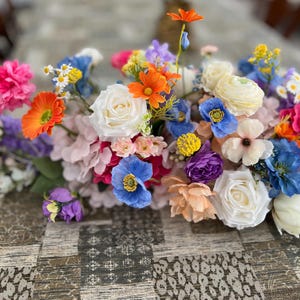 Colorful Arch Arrangements With Faux Flowers, Summer Wedding Table Arrangements, wild flowers arrangements, meadow arch decor, wedding swag