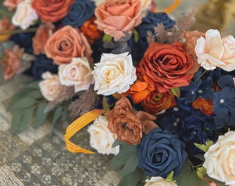 Wedding Table Arrangements With Navy Blue and Rust Orange and Terracotta faux flowers, rust orange and navy blue floral arbor arrangements