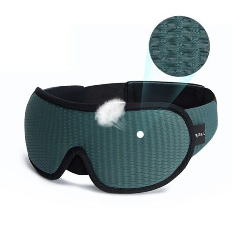 May include: Green sleep mask with a black adjustable strap and a breathable mesh fabric. The mask has a small hole for the nose.