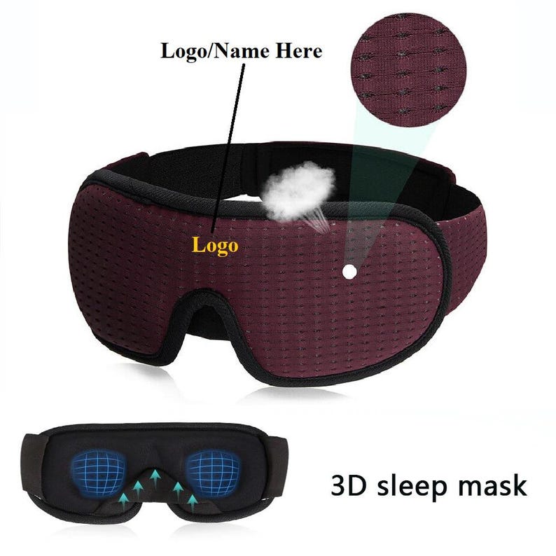 May include: A burgundy sleep mask with a black elastic band and a 3D design. The mask has a breathable mesh fabric and a logo on the front. The text "3D sleep mask" is visible below the mask.
