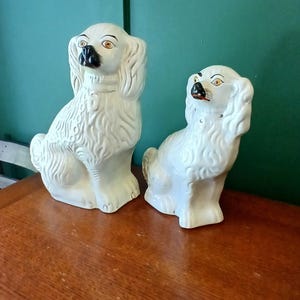 Pair of Victorian seated Staffordshire spaniel dogs