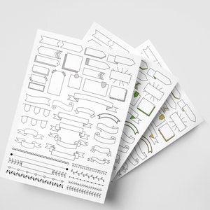 May include: Three sheets of paper featuring black and white line drawings of various shapes, including banners, ribbons, frames, and borders. The sheets are stacked on top of each other, with the top sheet displaying a range of decorative elements.