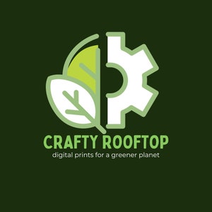 May include: A green leaf and a white gear icon are combined to form a circle. The text "CRAFTY ROOFTOP" is below the circle, and the text "digital prints for a greener planet" is below that.