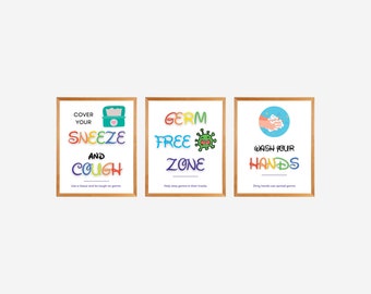 May include: Three colourful signs with a germ-free theme. The first sign says "Cover your sneeze and cough" with a tissue box illustration. The second sign says "Germ Free Zone" with a cartoon germ. The third sign says "Wash your hands" with an illustration of hands washing.