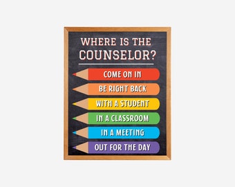 May include: A framed chalkboard sign with the text "WHERE IS THE COUNSELOR?" and colorful pencil-shaped indicators. The sign lists the counselor's possible locations: "COME ON IN," "BE RIGHT BACK," "WITH A STUDENT," "IN A CLASSROOM," "IN A MEETING," and "OUT FOR THE DAY."