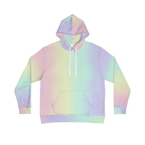 May include: A pastel rainbow ombre hoodie with a front pocket. The hoodie has a drawstring hood and long sleeves.