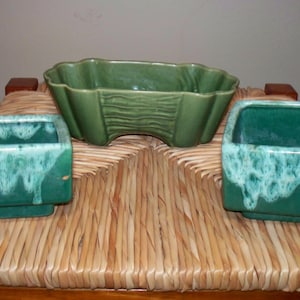 May include: A rustic wooden sign with the text "Welcome to our home" in white lettering. The sign features a distressed finish and a simple, inviting design, perfect for entryway decor.