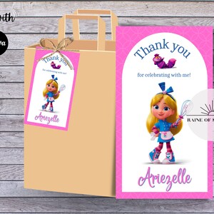 May include: A pink thank you card with a cartoon illustration of a girl dressed as Alice in Wonderland. The text on the card reads "Thank you for celebrating with me!" and is signed "Ariezelle".