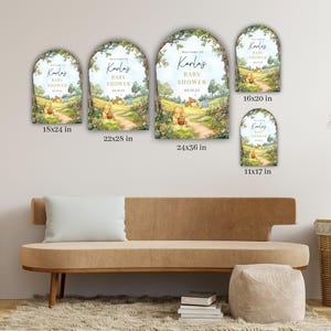 May include: Four different sizes of welcome signs for a baby shower. The signs feature a whimsical illustration of Winnie the Pooh and Piglet walking down a path in the woods. The text on the signs reads "Welcome to Karlas Baby Shower".