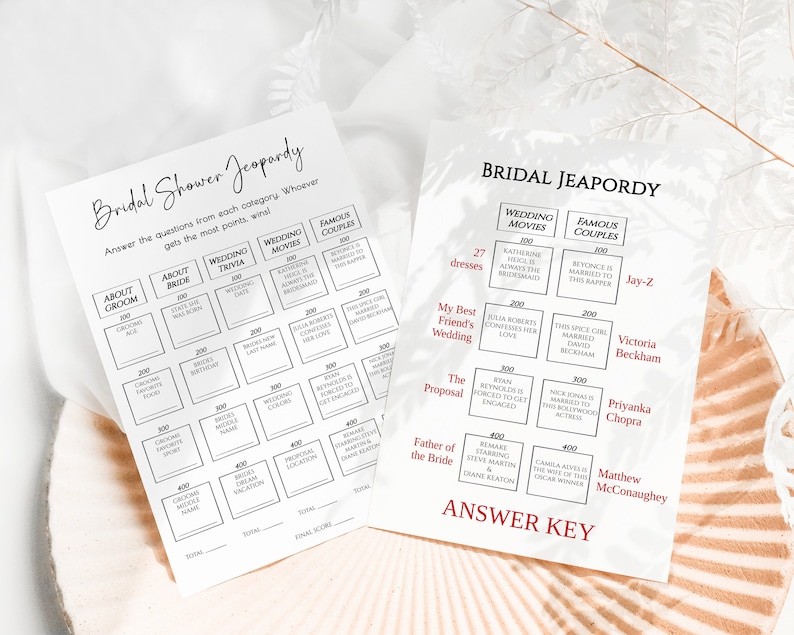 May include: A printable bridal shower game board with the title "Bridal Shower Jeopardy". The game board is divided into categories such as "About Groom", "About Bride", "Wedding Trivia", "Wedding Movies", and "Famous Couples". Each category has five questions with point values ranging from 100 to 400. The game board also includes an answer key with the correct answers to the questions.