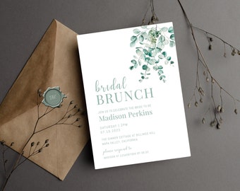 May include: A white invitation with green watercolor eucalyptus leaves and the text "bridal brunch" in a script font. The invitation is for a bridal brunch for Madison Perkins on Saturday, July 15, 2023 at 2 PM at The Dinner Cottage at Billings Hill in Napa Valley, California.