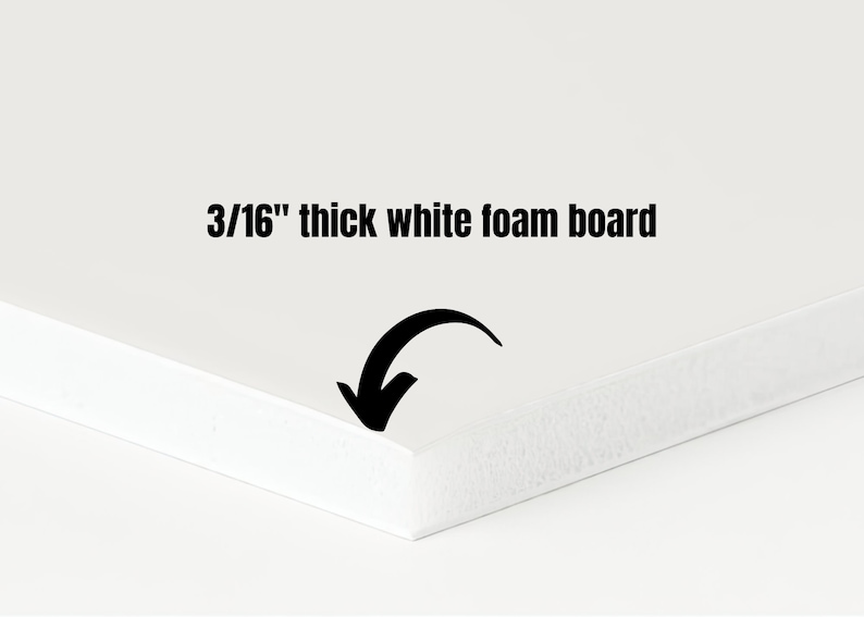 May include: A close-up of a white foam board, 3/16 inch thick. The board's edge is in focus, with a black arrow pointing towards it. The text "3/16" thick white foam board" is displayed in black.