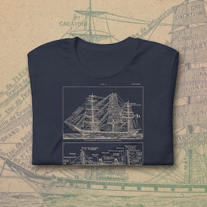 May include: A white ceramic mug with a black handle and the text "But First, Coffee" in a handwritten style. The mug is on a white surface. The mug is likely for hot beverages.