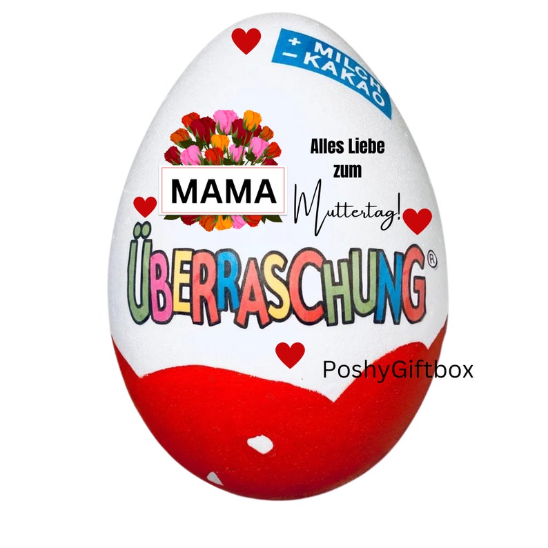 May include: A white chocolate egg with a red and white design. The egg has the words "Uberraschung" and "MAMA" on it. The egg is decorated with a bouquet of pink, red, and yellow flowers. The text "Alles Liebe zum Muttertag!" is also on the egg.