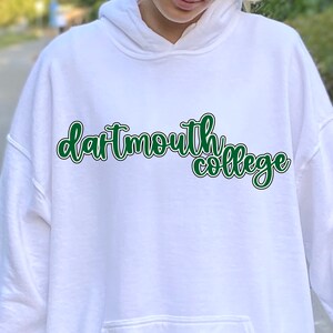 May include: White hoodie with a green and black outline of the text "dartmouth college" on the front.