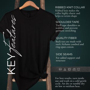 Kay details for a Folk Punk Linocut shirt with a black and white image of a crust punk Skeleton playing the fiddle in a graveyard. These Offensive T-Shirts have the words Love Loud, Like A Riot; at the top.