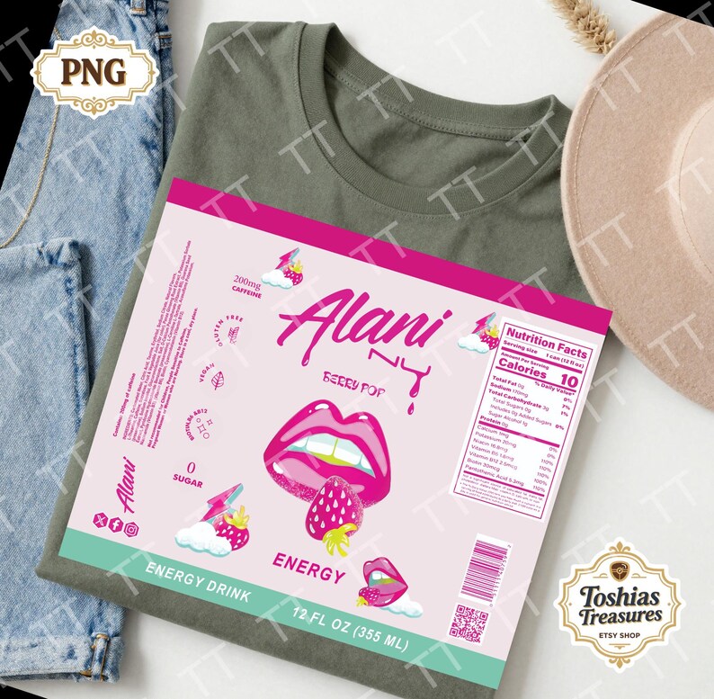 May include: An olive green t-shirt with a pink and white Alani Nu Berry Pop energy drink label. The label features a graphic of lips, a strawberry, and the text "Energy Drink" and "12 FL OZ (355 ml)".