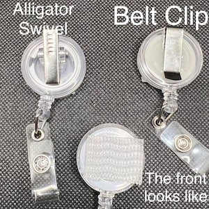 May include: Three clear plastic retractable badge holders with different attachments. The first has a metal alligator clip, the second has a metal belt clip, and the third has a clear plastic hook and loop fastener.
