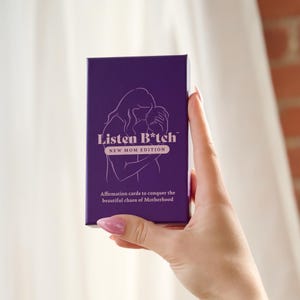 May include: Purple box of affirmation cards with the text "Listen B*tch" and "New Mom Edition". The box features a line drawing of a woman holding a baby.
