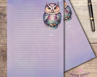 May include: Purple lined stationery with a watercolor owl illustration. The owl has brown, blue, and purple feathers. A black and gold pen rests on a wooden surface. The stationery has the text "Lykkelige Letters".
