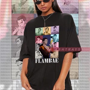 May include: Black unisex t-shirt featuring a colorful collage of images and the word "FLAMBAE" in white. The shirt has a crew neck and short sleeves. The model is wearing a 2XL shirt.