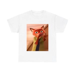 May include: White t-shirt featuring a cartoon image of Nick Wilde from the movie Zootopia. The image shows Nick with his hand up to his mouth. The shirt is a classic crew neck style.