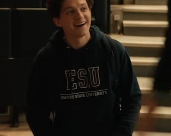 May include: A dark navy blue hooded sweatshirt featuring a white graphic print on the chest that reads ESU and Empire State University in a collegiate font. The garment includes a drawstring hood and long sleeves, constructed from a cotton blend fabric.