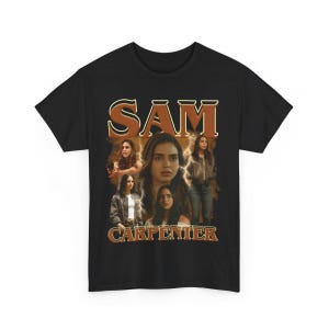 May include: Black t-shirt featuring a vintage-style design with the name "SAM" in large, brown lettering. The design includes multiple images of a woman, with the name "CARPENTER" below in brown text.