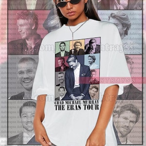 May include: White unisex t-shirt featuring a graphic of Chad Michael Murray and the text "The Eras Tour." The shirt has a grid of images of Murray. The model is wearing a 2XL shirt.