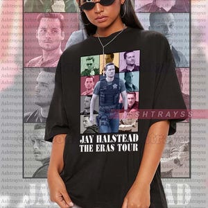 May include: Black unisex t-shirt featuring a collage of images of a person, with the text "JAY HALSTEAD THE ERAS TOUR" in white. The model is wearing the shirt.