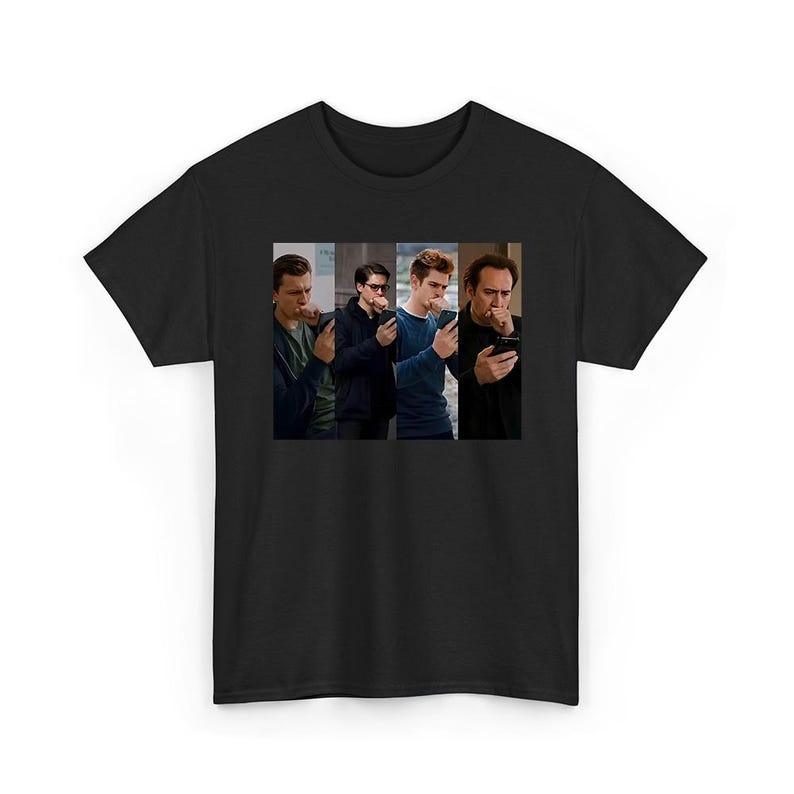 May include: A black short-sleeved t-shirt featuring a central rectangular graphic print. The design displays four separate vertical panels, each showing a different person looking down at a smartphone while holding a hand to their mouth.