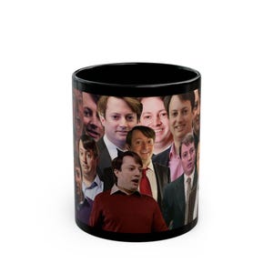 May include: Black ceramic coffee mug featuring a collage of faces. The faces are of a man in various expressions and outfits. The mug is a standard size and shape, suitable for hot or cold beverages.