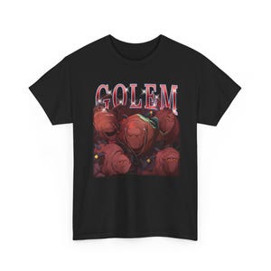 May include: Black t-shirt with a graphic of several brown, stone-like figures and the word "GOLEM" in red and white text. The figures have a stern expression and are wearing headphones.