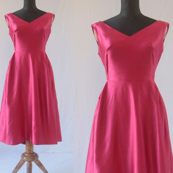 S 1950s pink dress in silk satin with unusual dart pleat detail and bow Old Hollywood glamour gown