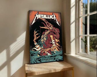 May include: A framed poster featuring the band Metallica. The artwork has a black background with a monster illustration in red, orange, and teal. The band's name is in orange, stylized text. The poster is displayed on a woven bench.