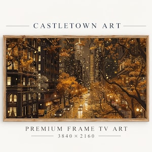 以下が含まれることがあります： CASTLETOWN ARTと題された長方形の額入りデジタルアート作品。夜の街並み、黄金色の秋の木々、ライトアップされたビルの窓、濡れた道路を走る車が描かれています。下のテキストにはPREMIUM FRAME TV ART 3840 x 2160と記載されています。