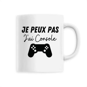 Peut inclure: Mug en céramique blanche avec un motif de manette noire et le texte "JE PEUX PAS J'ai Console". La tasse a une anse incurvée, idéale pour les boissons chaudes.