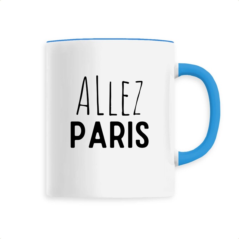 May include: White ceramic mug with a blue handle and rim. The mug features the words "ALLEZ PARIS" in black, uppercase letters. The design is simple and modern, suitable for coffee or tea.