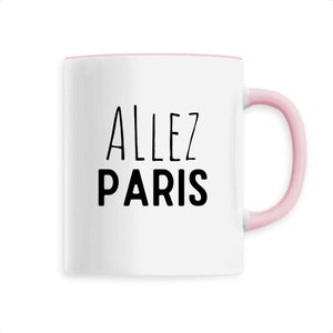 May include: White ceramic mug with a pink interior and handle. The mug features the words "ALLEZ PARIS" in black, handwritten-style lettering. A simple and stylish design.