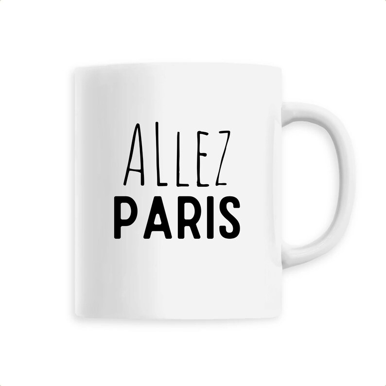 May include: White ceramic mug with the words "ALLEZ PARIS" printed in black. The mug has a curved handle and a simple, clean design. Perfect for coffee, tea, or any favorite beverage.
