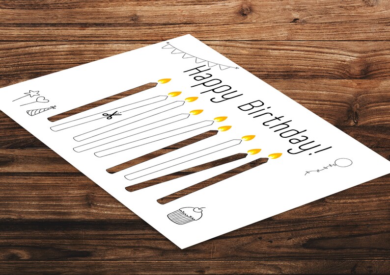 May include: A printable birthday card with a black and white illustration of candles, a cupcake, and a party hat. The text "Happy Birthday!" is written in black.