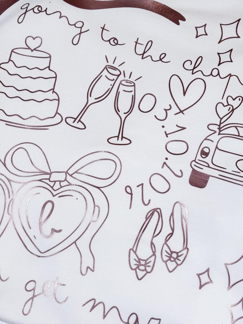 May include: White background with rose gold line art of wedding-themed illustrations. Includes a tiered cake, champagne flutes, a heart, a car with hearts, a pair of shoes, and the text "going to the chapel" and "get married".
