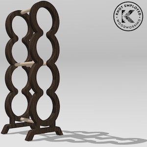 May include: A dark brown wooden wine rack with a unique design featuring multiple circular openings. The rack has a simple, modern aesthetic and is made of sturdy wood.